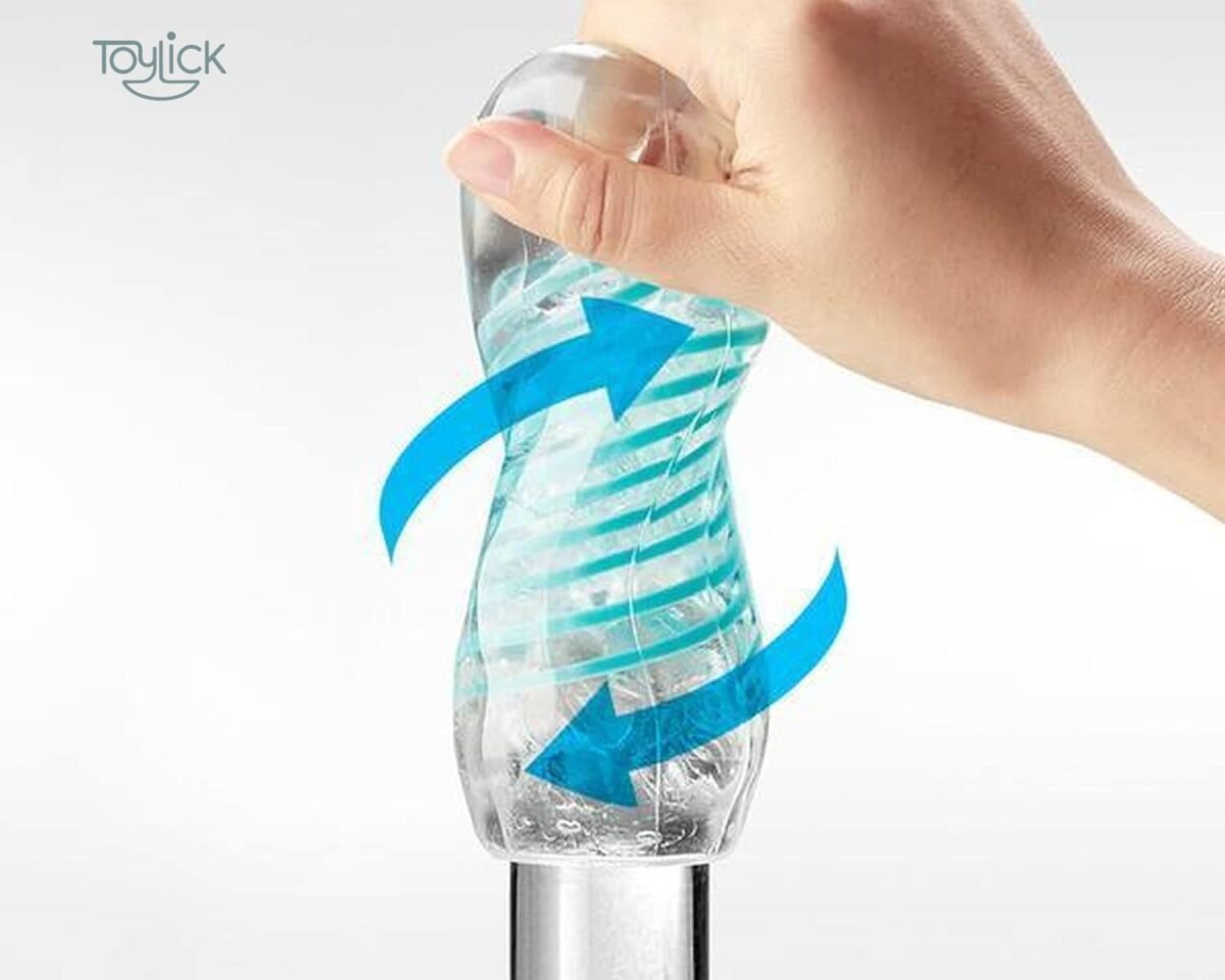 TENGA Spinner SPN-006 being twisted by a hand, illustrating the spiral motion with curving blue arrows on the clear, ribbed sleeve.