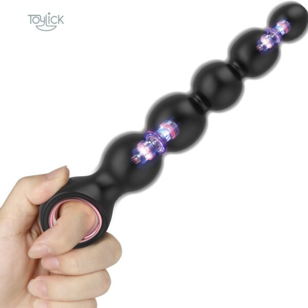 A main product shot of the Toylick Vibrating Anal Beads Butt Plug against a clean white background. A hand is holding the toy by its ring-style base, which has a pink metallic accent. Cutaway graphics on the black silicone beads reveal the two internal motors glowing with blue and pink light.